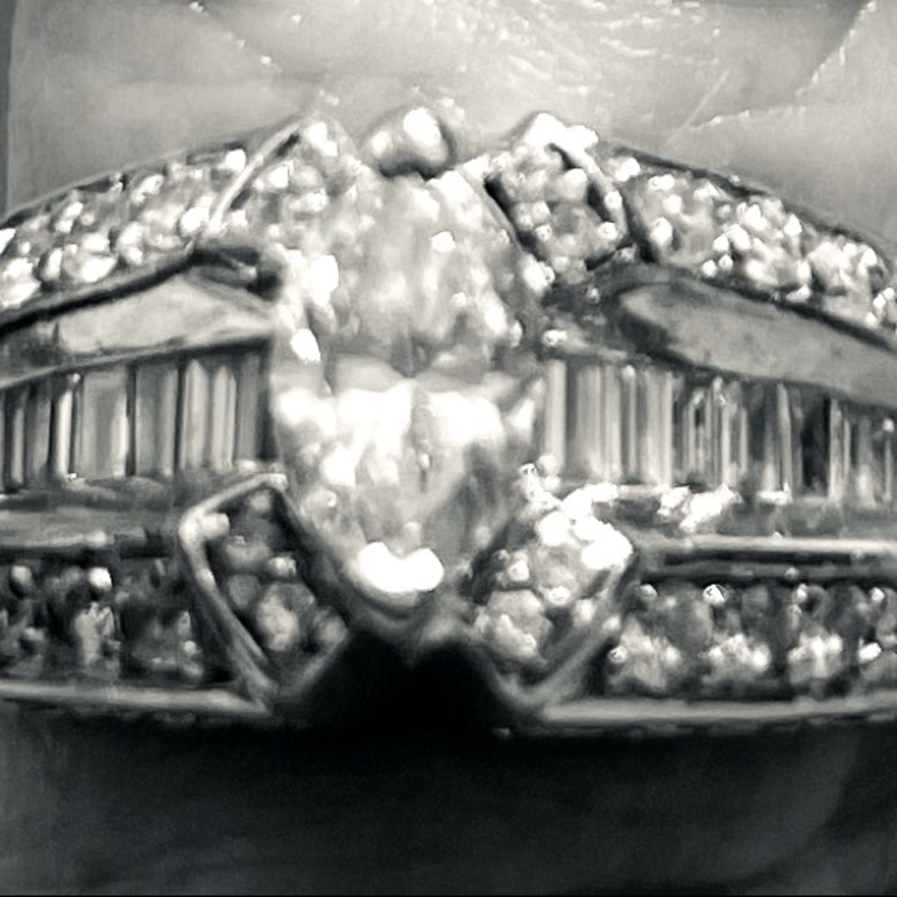 14 karat white gold ring.  Meet at jewelers to have an appraiser verify quality